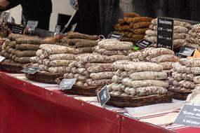 Colorful sausages with signs, at the Market Day in Forcalquier, France