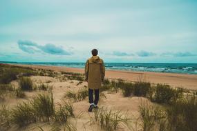 boy on Grass Beach Ocean