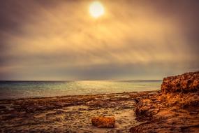 Beautiful and colorful rocky coast of the sea in Ayia Napa, Cyprus, at colorful and beautiful sunset