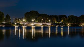 view from the water to the bridge in hamburg at night