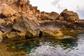 Beautiful landscape of the colorful Cavo Greko with colorful rocks, among the water, in Cyprus, Greece