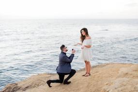 Couple wedding propose on coast