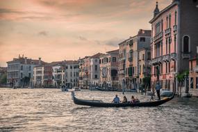 gondolas in the city at dusk