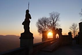 silhouettes of the castle fortress at dusk