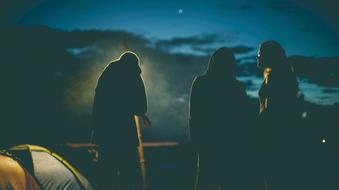 People near tent in Camping at night