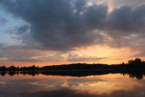 pink sunset over a body of water in saarland, Germany