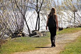 woman walking on lake Beach