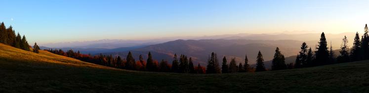 Beautiful landscape of the colorful Tatry Mountains with trees, in Poland, at beautiful and colorful sunset