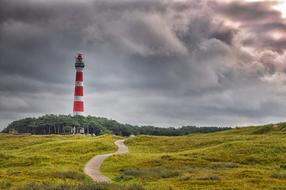 striped lighthouse on the North Sea coast in Ameland, Netherlands