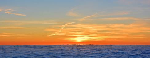 red-orange sky during dawn over the sea