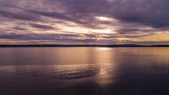 purple Sunset over calm water, background