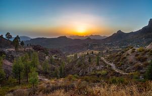 sunset in the mountains in a picturesque landscape