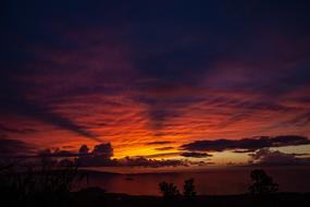 sunset in the clouds over the Hawaiian coast