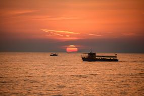 Boats on Sea at red Sunset