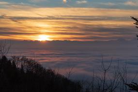 Beautiful landscape of the sea of fog at colorful and beautiful sunrise, from the mountains