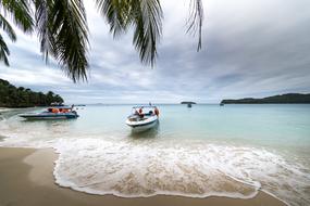 boats on the coast of a tropical island in Asia