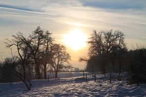 winter rural landscape at sunset