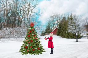 child girl near Christmas tree in village, collage