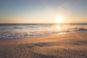 sun rising at horizon, view from Sand Beach