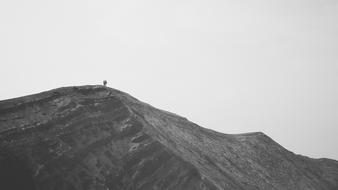 Black and white photo of the couple, climbing on the beautiful mountain