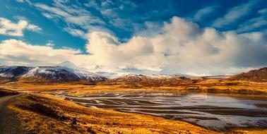 white clouds over the scenic landscape of iceland