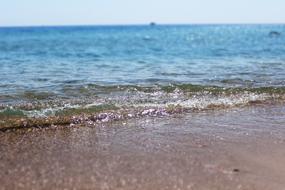 Beautiful landscape of the sandy beach with wave, in Egypt
