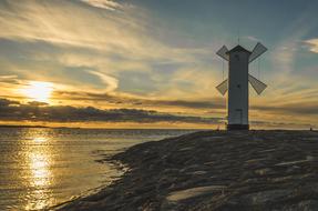 windmill on the seaside at dusk