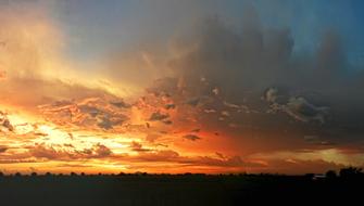 golden clouds over countryside at Sunset