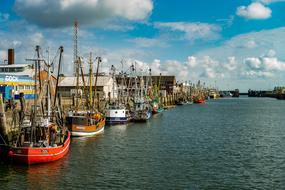 fishing boats in the port on the calm water of the sea