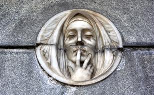 Sculpture with face, at the cemetery in Recoleta, Buenos Aires in Argentina