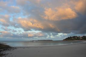 twilight over a sandy beach on the coast of brittany