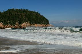 Beautiful Black Broke Beach with waves and green forest, in Canada