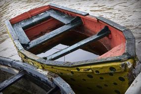 water in an abandoned wooden boat close up
