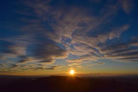 Beautiful landscape with silhouettes, in colorful and beautiful sunset with clouds
