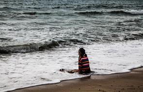 girl in the waves of the surf in thailand