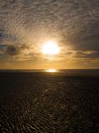 Beautiful beach of the sea, at beautiful sunrise among the clouds