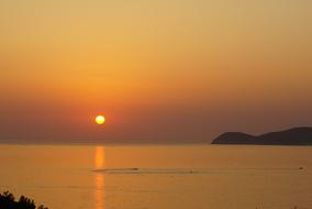 sun reflection on water, golden sunset