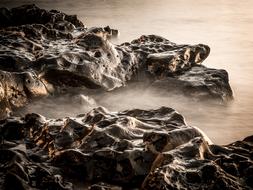 Beautiful, and colorful rocks in clouds, in Cala Gonone, Italy