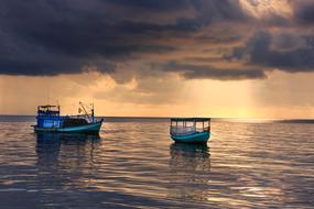fishing boats at sea during sunset in vietnam