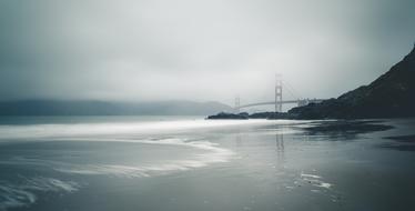 Foggy Beach and Bridge