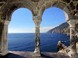 view from the stone window to the blue sea