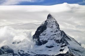 Beautiful, snowy Matterhorn in clouds, in Zermatt, Switzerland