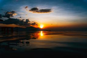 Beautiful sea in colorful and beautiful sunset with clouds