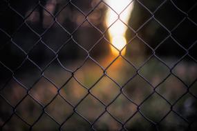 Fence mesh on the background of fire