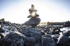 balance stone pyramid on the beach