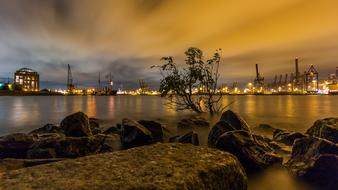 rocky coast on the Elbe with a view of the port