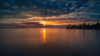 sunset in the clouds over a lake in switzerland