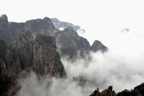 white clouds in a mountain landscape