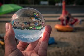 Glass Ball sphere on Beach