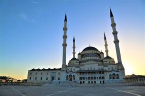 mosque with minarets at dusk